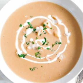 bowl of shrimp bisque with shrimp and chives