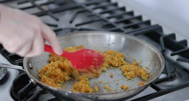 cooking mirepoix in a pan with oil