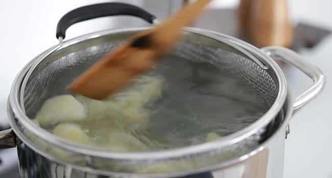cooking potatoes in a pot of boiling water