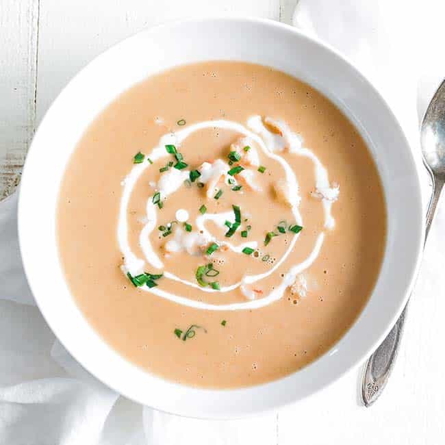 bowl of shrimp bisque with shrimp and chives