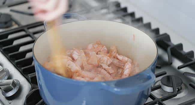 cooking shrimp shells in a pot