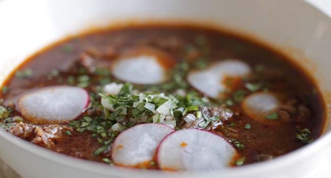 serving soup with garnishes