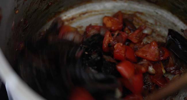 roasted tomatoes, peppers, and spices in a pot