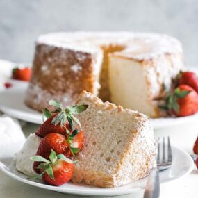 slice of angel food cake with whipped cream and berries