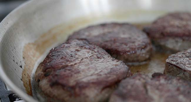 pan seared beef tenderloin steaks in a pan