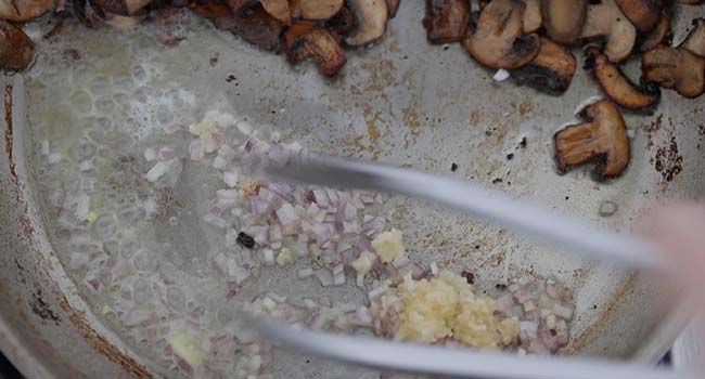 cooking shallots and garlic in a pan