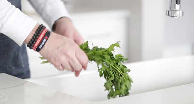 rinsing parsley in the sink