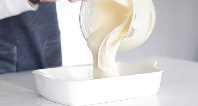 pouring batter into a casserole dish