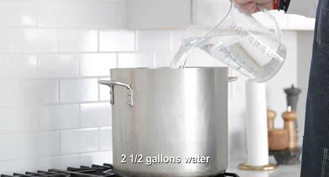 pouring water into a stockpot