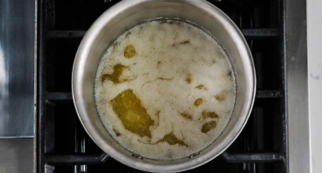 frothy melted butter in a pot