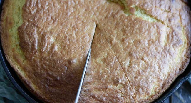 slicing homemade sweet cornbread