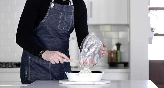 pouring the southern cornbread batter into a skillet