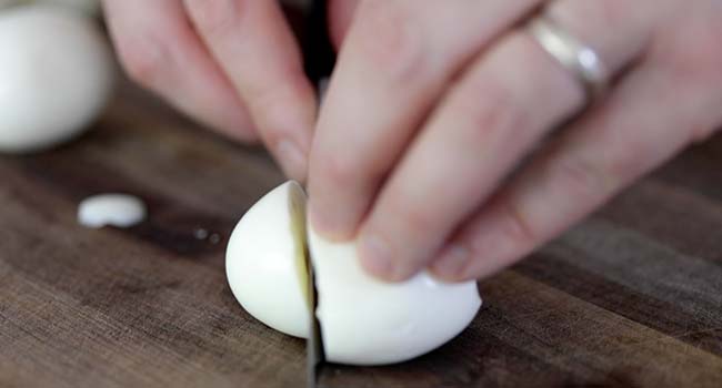 slicing a hard boiled egg