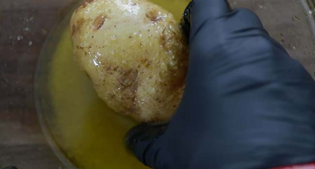 coating a potato in oil and salt