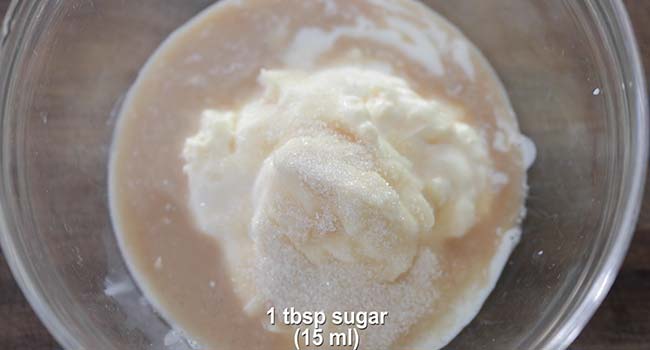 adding buttermilk to a bowl of mayonnaise and vinegar