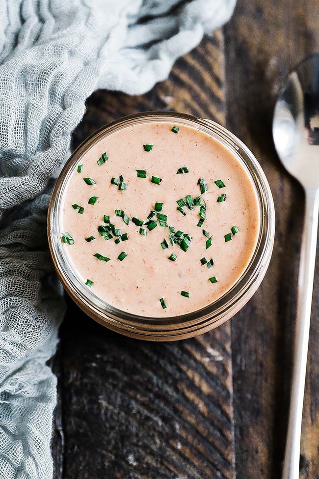 homemade comeback sauce in a jar with chives