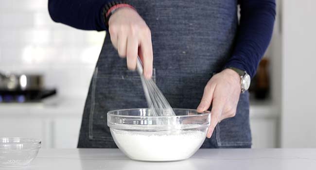 whisking a batter of wet ingredients in a bowl