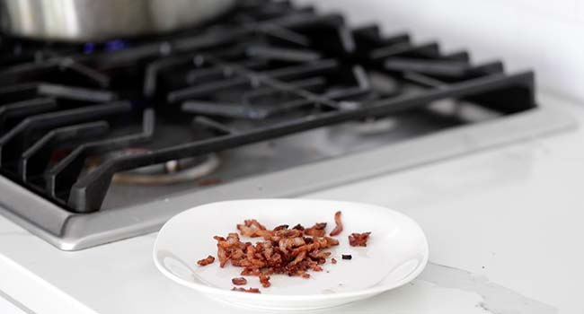 crisp bacon lardons on a plate