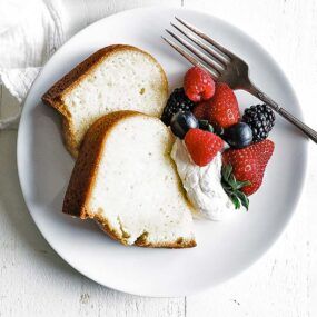 two slices of pound cake with whipped cream and berries