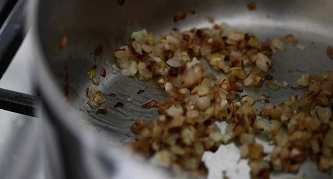 caramelizing onions and garlic in a pot