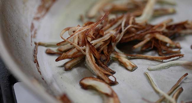 roasted onions and garlic in a pan