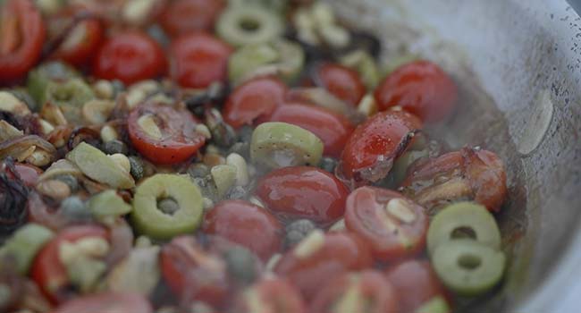 tomato and olive compote in a pan