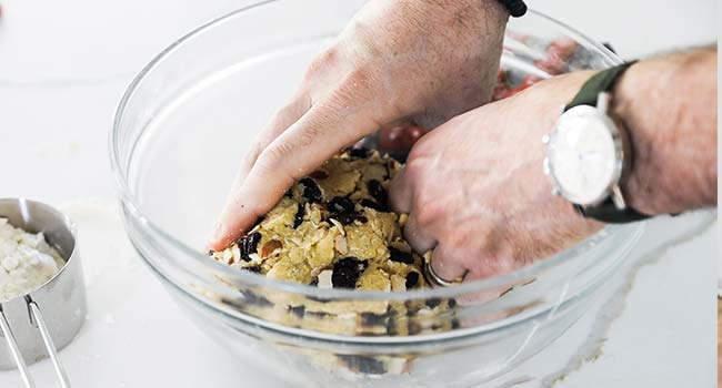 kneading a biscotti dough in a bowl