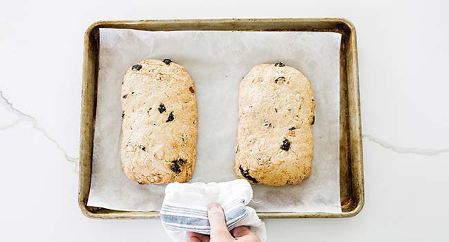 baked biscotti loaves on a sheet tray