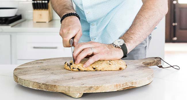 slicing a biscotti loaf