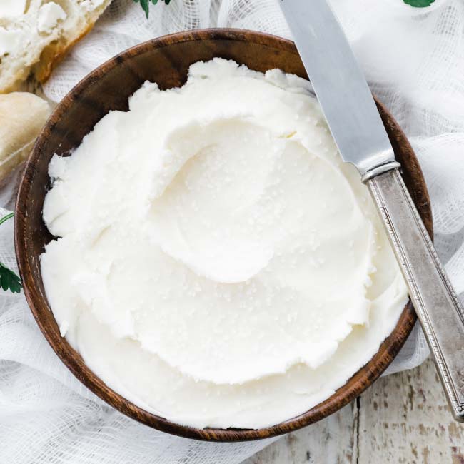 plate of homemade butter with a knife