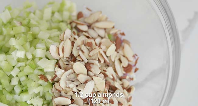 sliced almonds with celery in a bowl