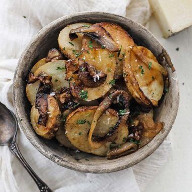 bowl of lyonnaise potatoes with parsley