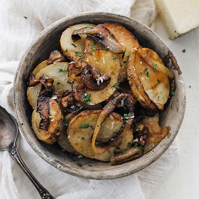 bowl of lyonnaise potatoes with parsley