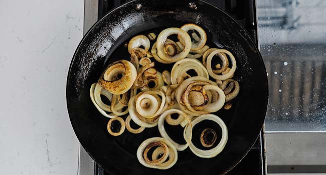 caramelized onion rings in a pan