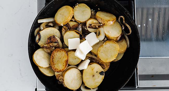 finishing lyonnaise potatoes with butter