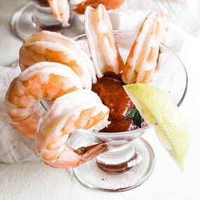 shrimp cocktail in a glass with lemon