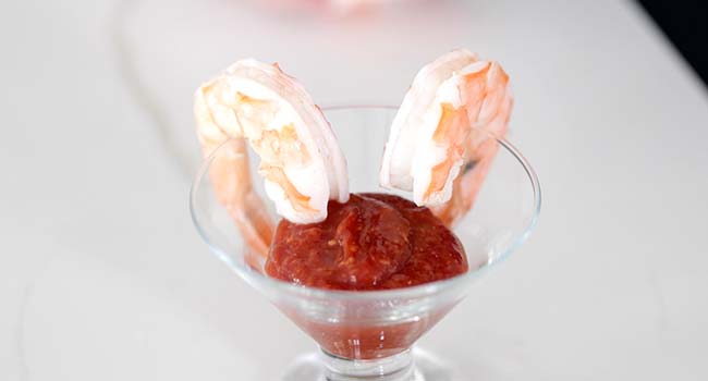 serving shrimp with cocktail sauce