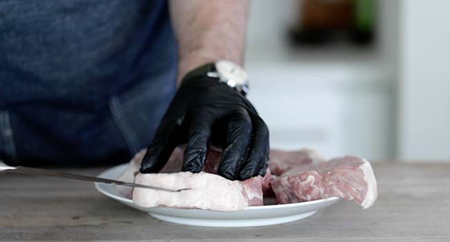 slicing a pork chop
