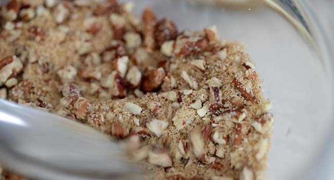 mixing together a pecan crumb topping