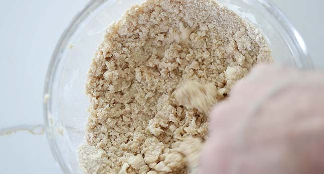 making a streusel topping in a bowl