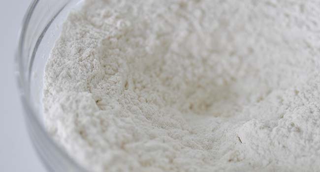 mixing together dry ingredients in a bowl