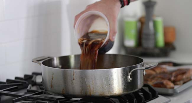 pouring extra marinade into a pan