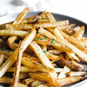 a plate of belgian style french fries
