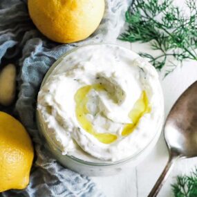 bowl of tzatziki with olive oil and lemon