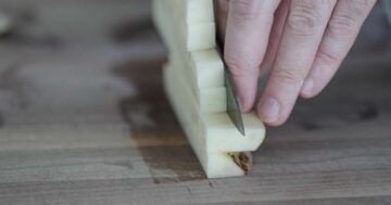 slicing potatoes into fries