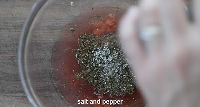 adding herbs and vinegar to a bowl