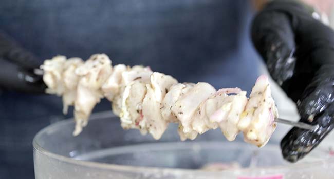 skewering chicken souvlaki