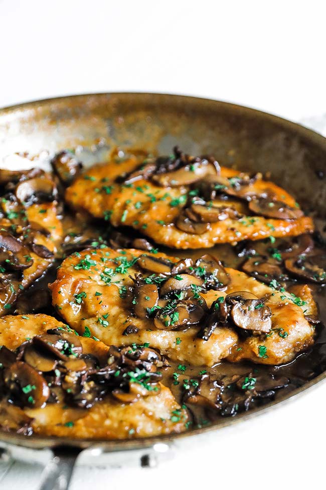 large frying pan of chicken marsala