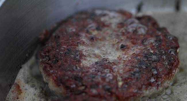 seared salisbury steak in a pan