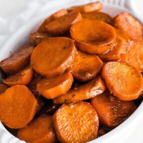 dish of sweet candied yams with cinnamon